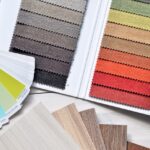 Colorful fabric and paint swatches laid out for design inspiration and material selection.